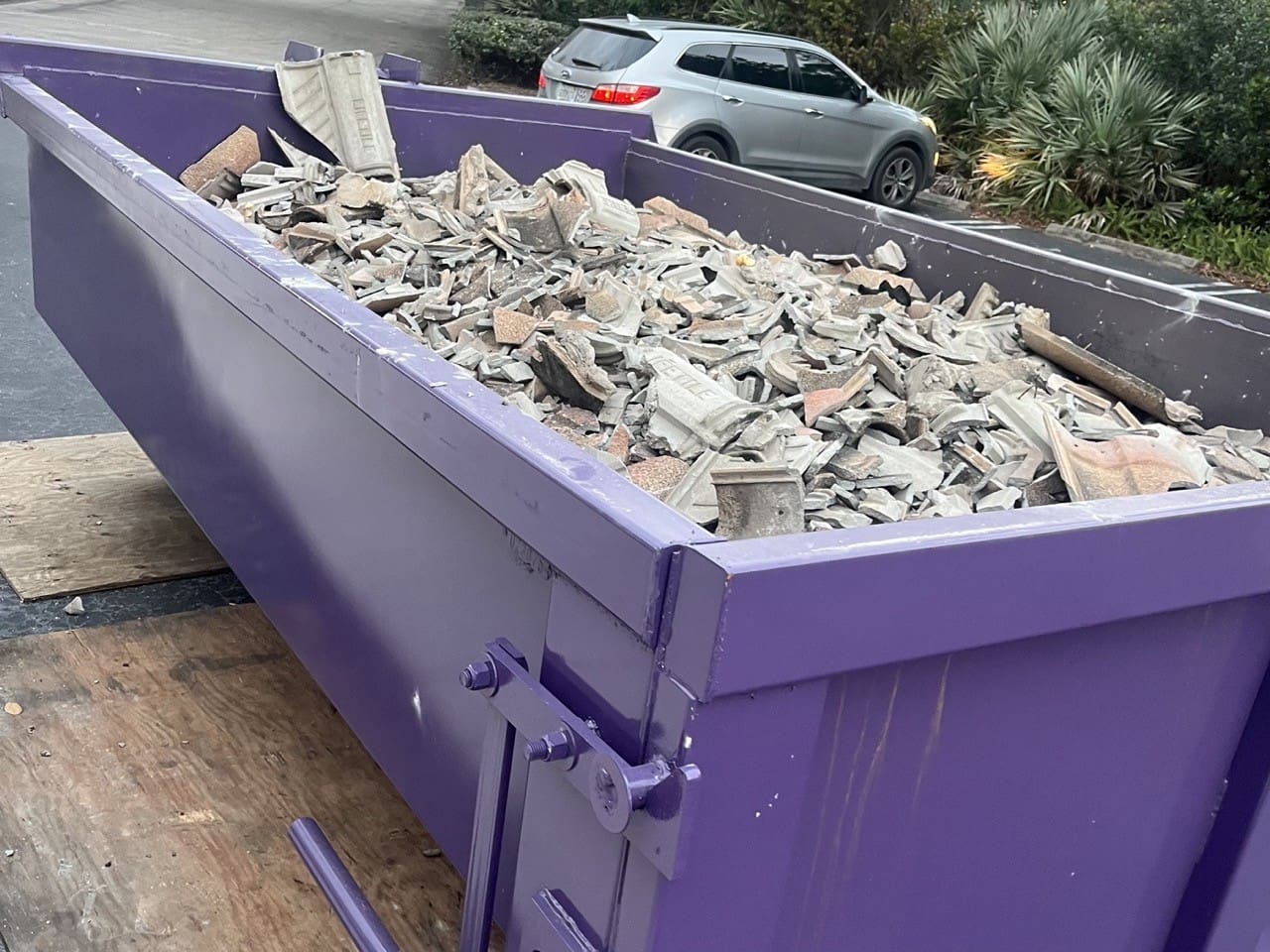 Chickadee dumpster for waste management in Vero Beach, offering dependable dumpster rental services.