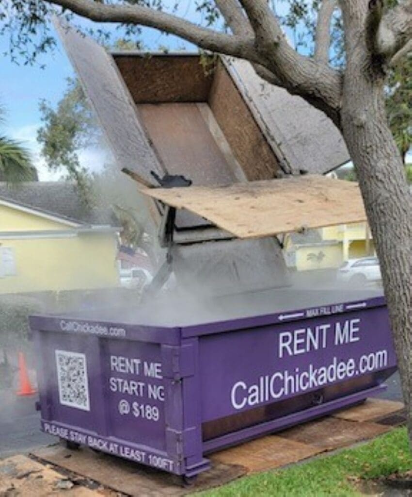 Roofing Dumpster rental with a tractor and tile roof disposal